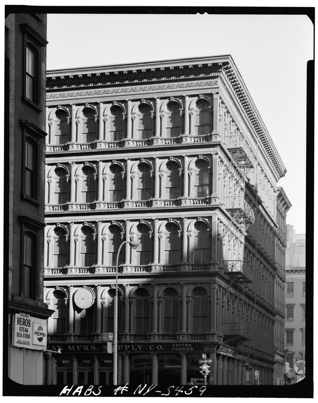 Historic photo of a cast-iron building at Broadway and Broome Street, SoHo